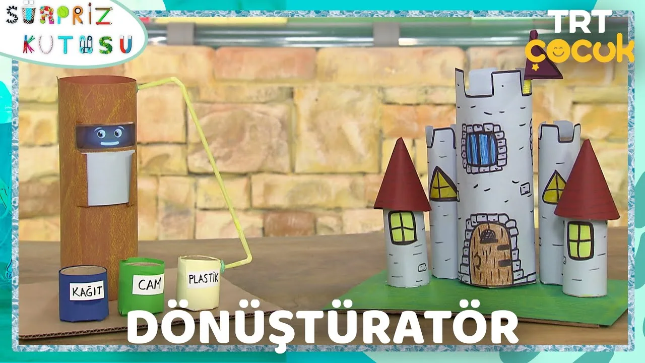 Thumbnail for the Sürpriz Kutusu episode Dönüştüratör, with recycling bins and a handmade cardboard castle.